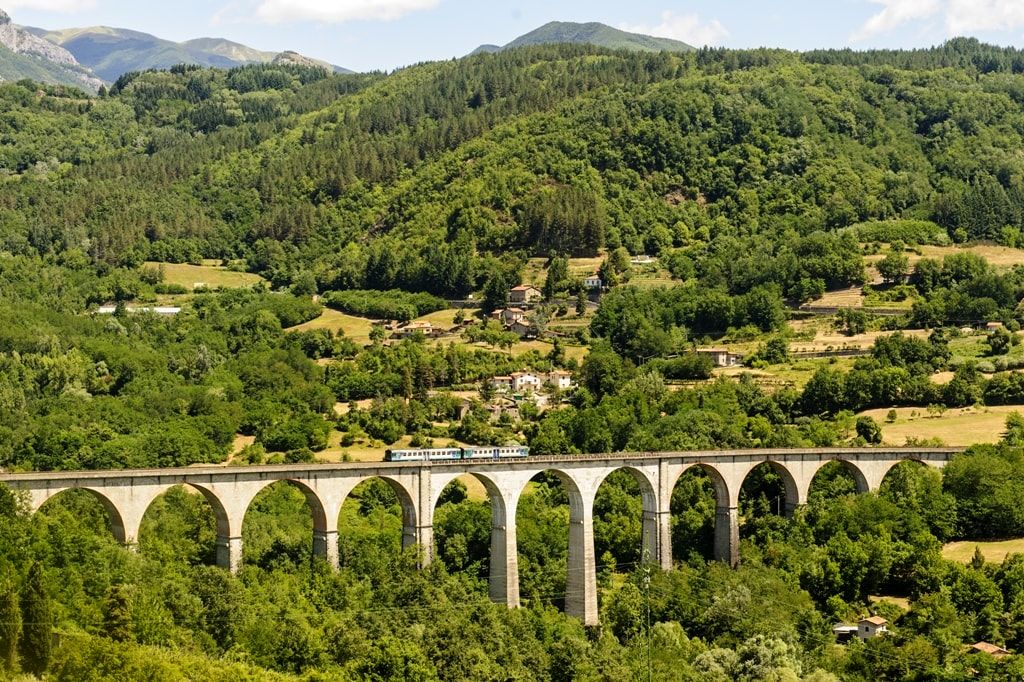 Landscape-in-Garfagnana-Lucca-Tuscany-Italy-at-summer-with-train-min